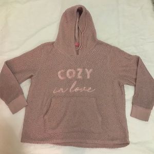 A pink sweatshirt with hood. In fair condition.
